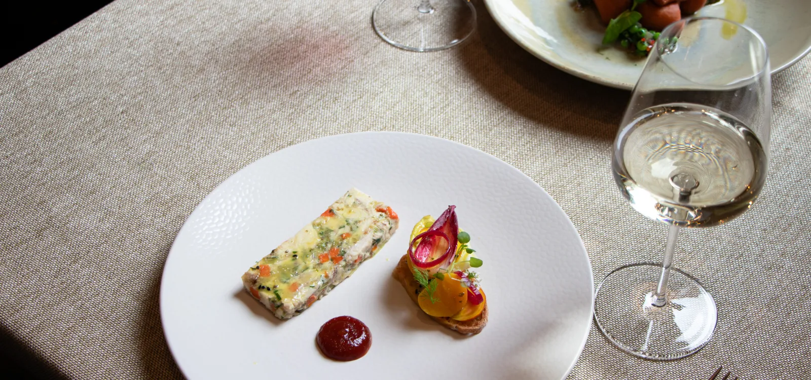 Seasonal starter served with a glass of white wine at The Elgar Room