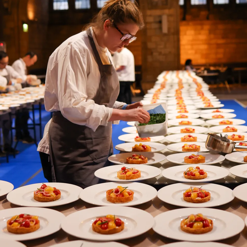 Chef preparing dishes at the kitchen in NHM for the dinner event 