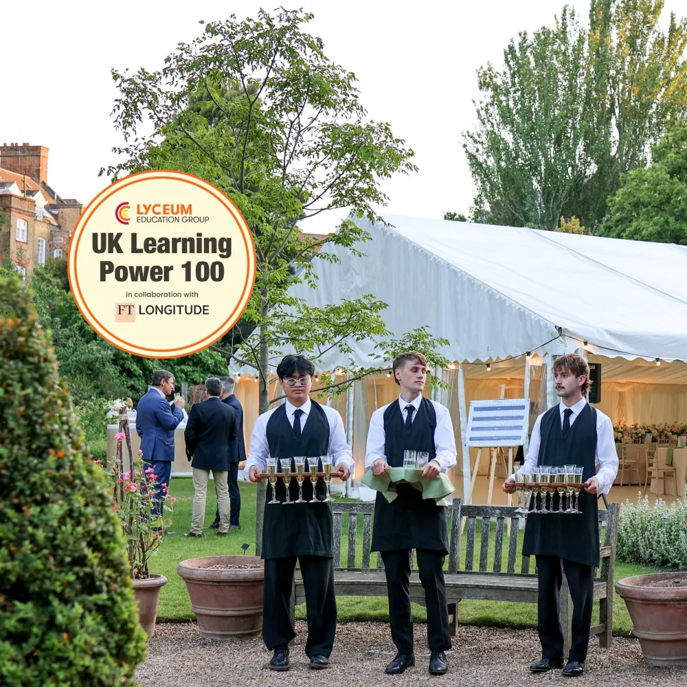 Chelsea physic garden - staff waiters holding drinks trays - Logo of Uk Leaning Power 100