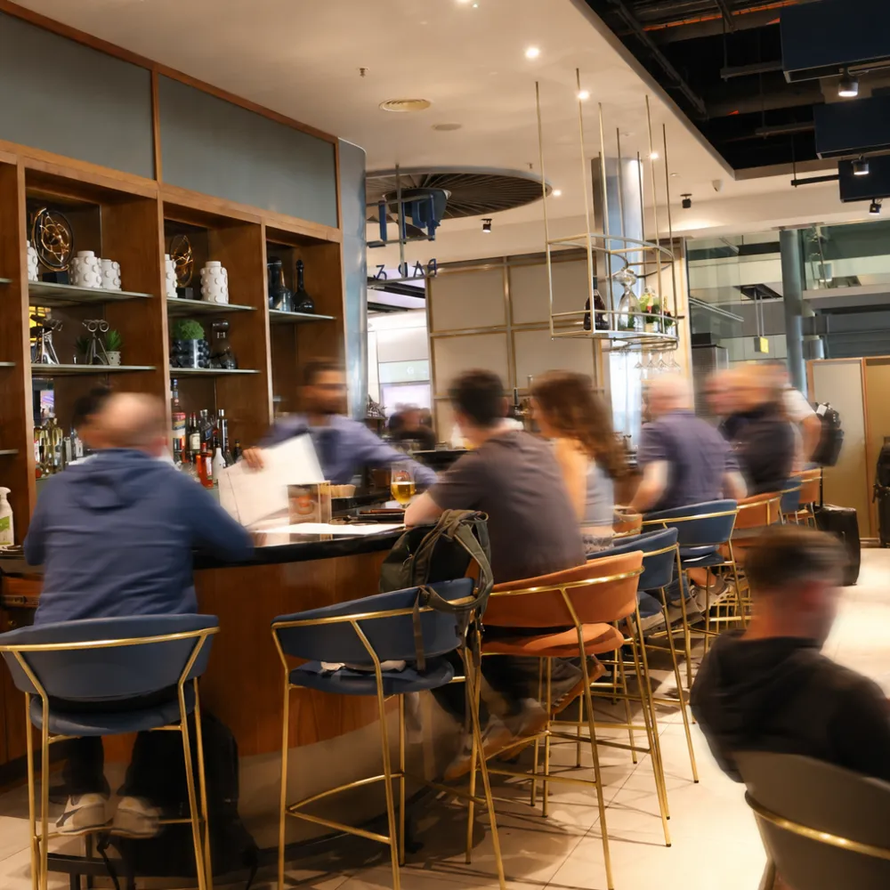 people eating at an aiport restaurant 