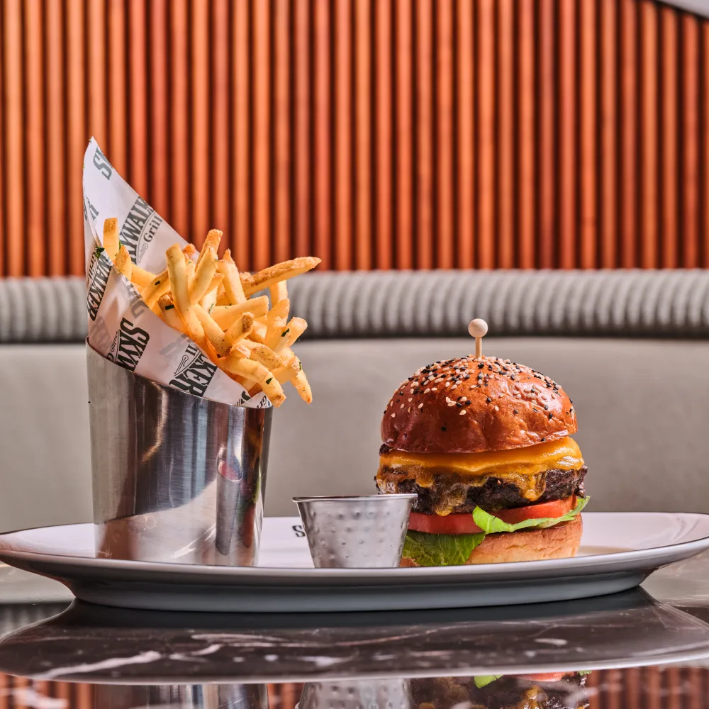 Ranch Wagyu Burger with melted cheese, lettuce and tomato, served with fries at Skywalker Grill.