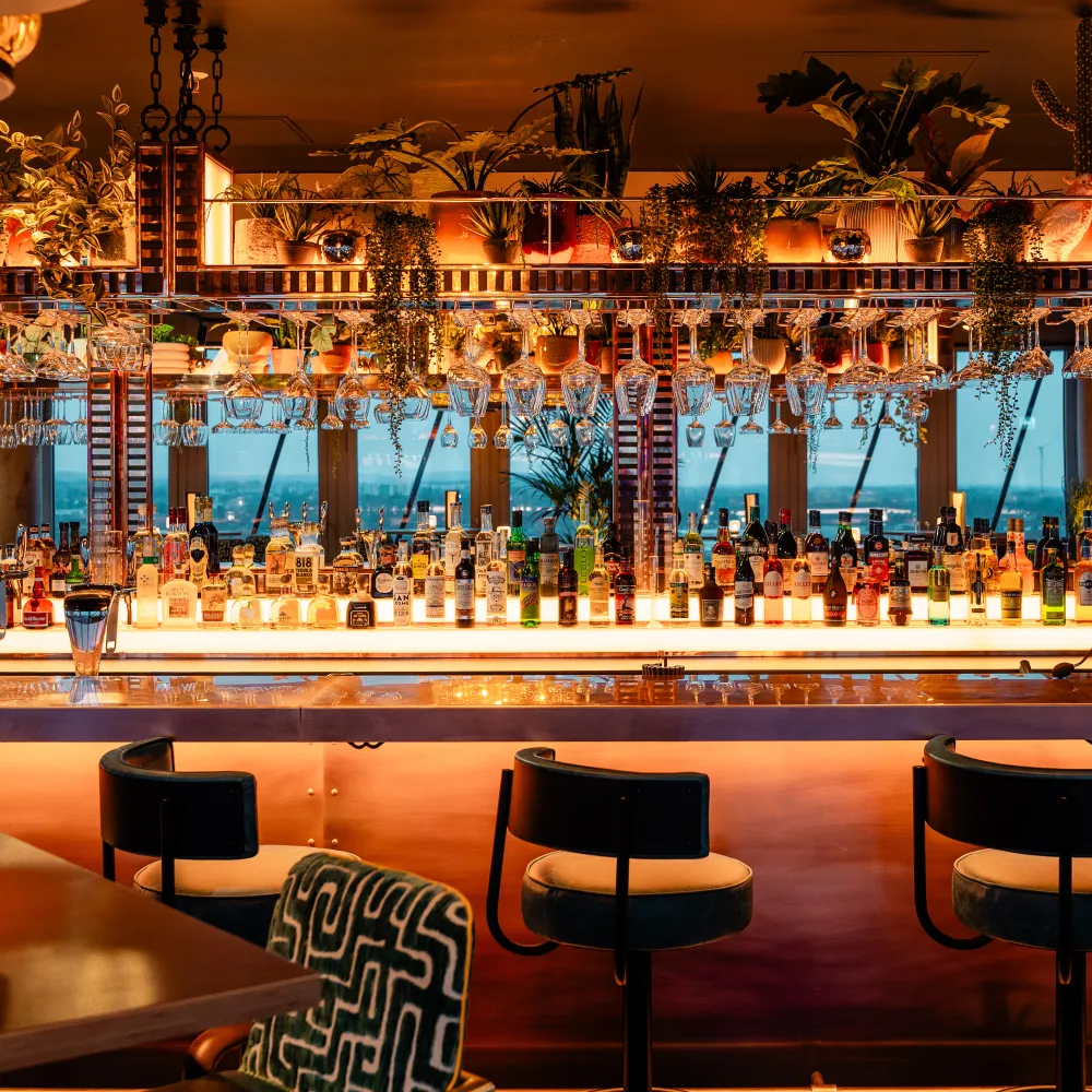 Interior of Air Bar 13, featuring a bar with lots of bottles