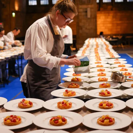 Chef preparing dishes at the kitchen in NHM for the dinner event 