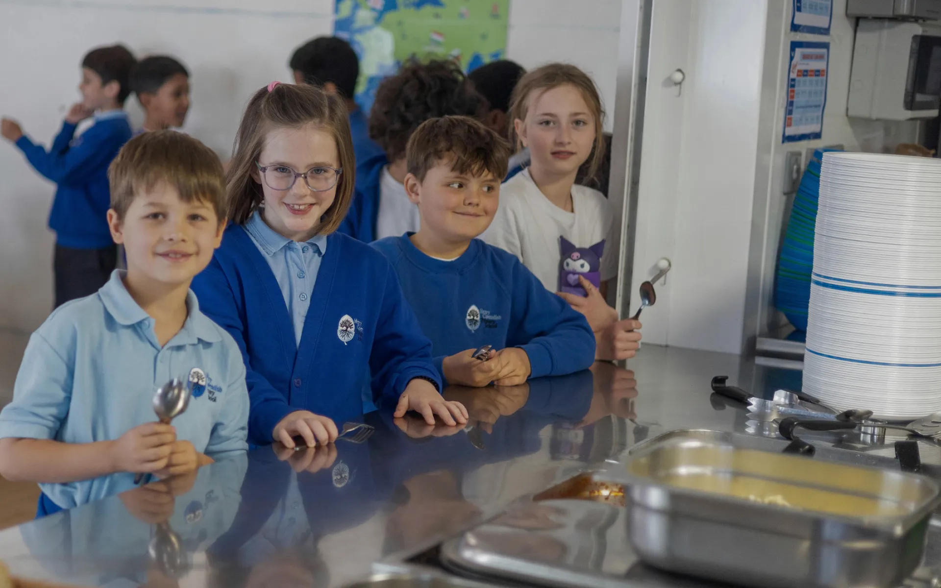 children waiting for food at a school