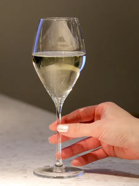 Frameless cafe bar glass of white wine