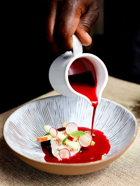 Starter beautifully presented by pouring a sauce at The Elgar Room
