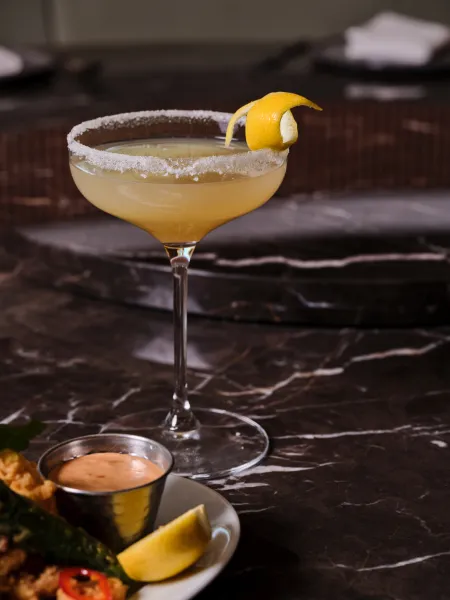 Cocktail served on a black marble table at Skywalker Grill