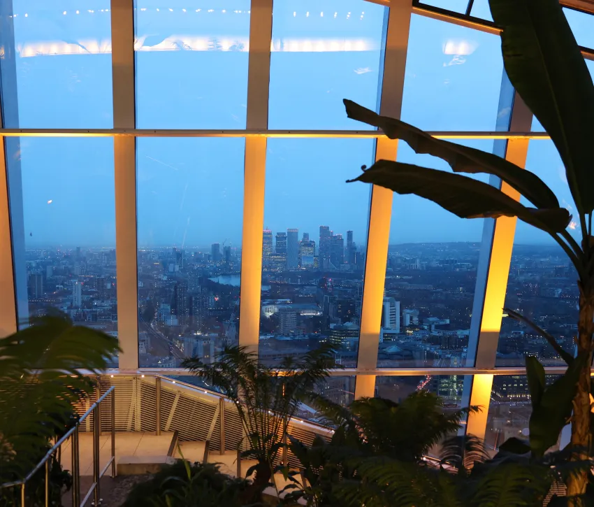 Image taken in 2026 of the view from Sky Garden, image found on the sustianbility page of the Rhubarb Website. You can see plants, skyline views. 