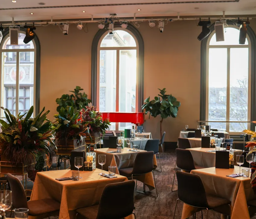 Venue shot of the Elgar Room with tables and a red piano