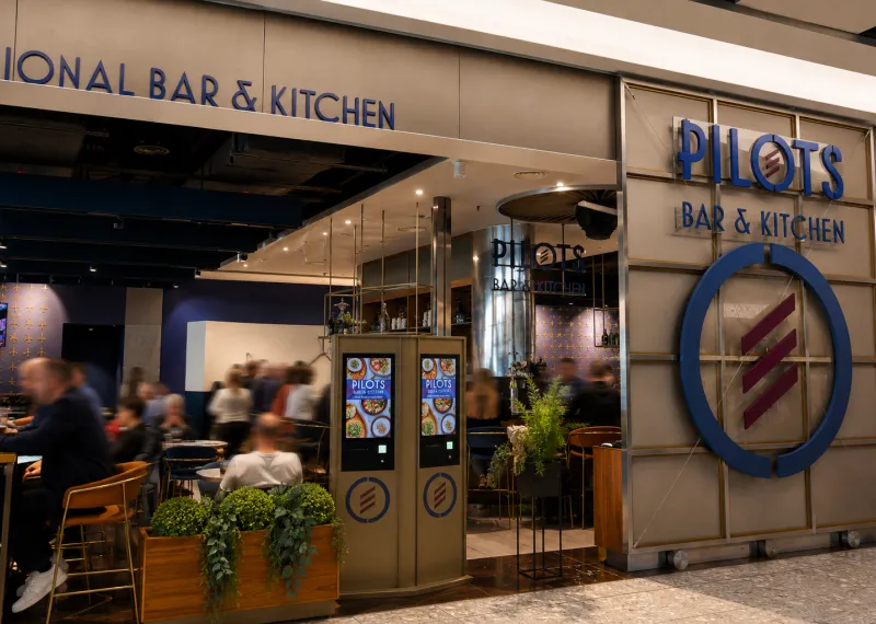 People eating at an airport restaurant