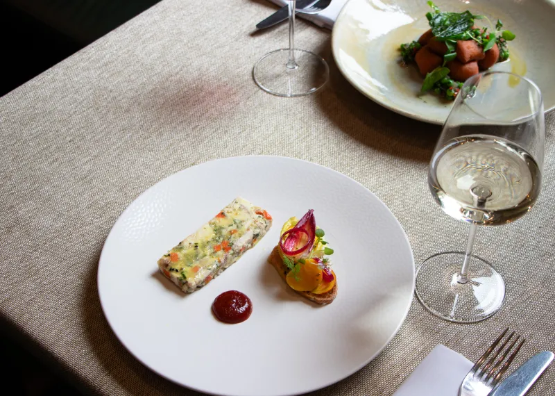 Seasonal starter served with a glass of white wine at The Elgar Room